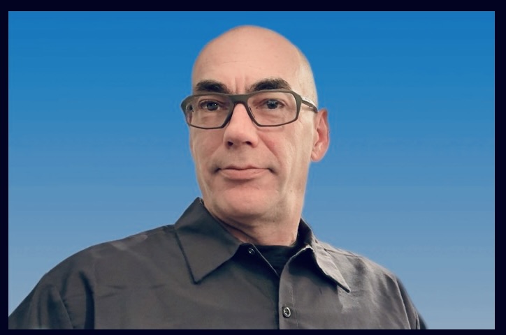 Don Boucher, founder of dbaiservices.io, against a blue background. Professional headshot for About Us page.